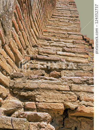 Brick wall in stone Brick wall in stone 124352737