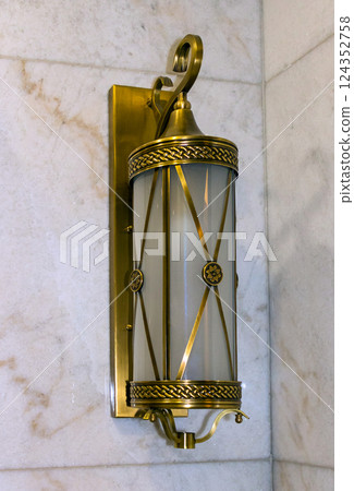 Old lantern on wall 124352758
