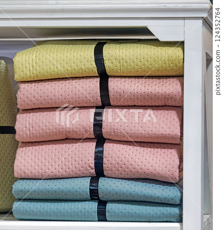 Textile wraps in shelf Textile wraps in shelf 124352764