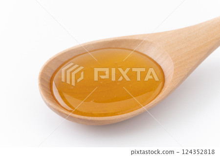 Close-up of honey on a spoon Close-up of honey on a spoon 124352818