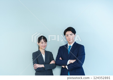 Business person with arms folded Blue back Business person with arms folded Blue back 124352891