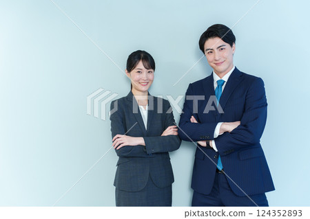 Business person with arms folded Blue back 124352893