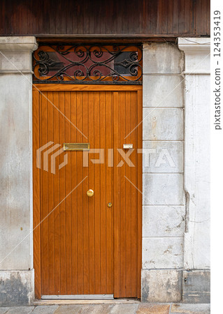 Retro closed brown entrance door Retro closed brown entrance door 124353419