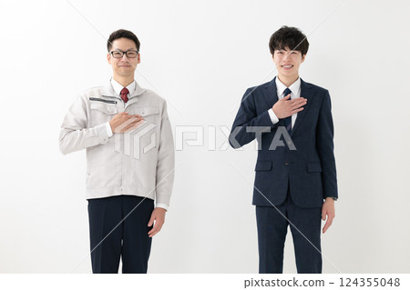 A man in a suit and a man in work clothes 124355048