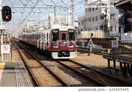 Limited express train arriving at Hankyu Nishinomiya Kitaguchi Station Limited express train arriving at Hankyu Nishinomiya Kitaguchi Station 124355445