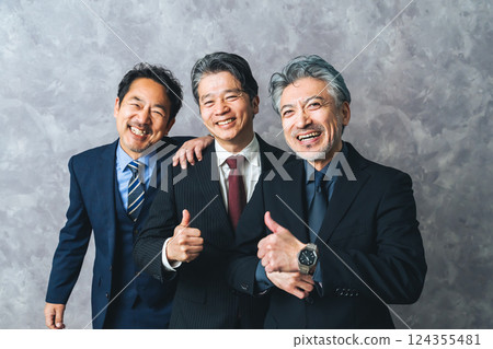 Group of smiling middle-aged male business people Group of smiling middle-aged male business people 124355481