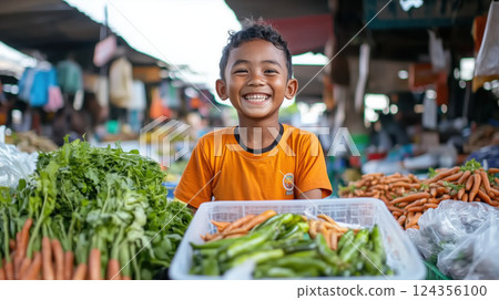 cheerful boy smiling at vibrant market stall with fresh vegetables 124356100
