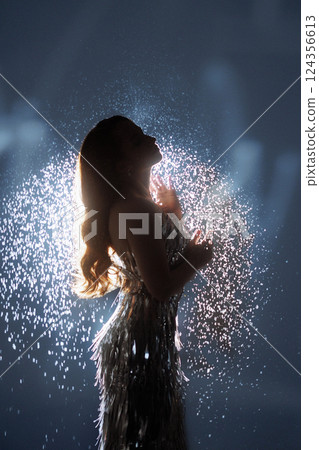 Glamorous Woman in Sparkling Light and Falling Glitter Glamorous Woman in Sparkling Light and Falling Glitter 124356613