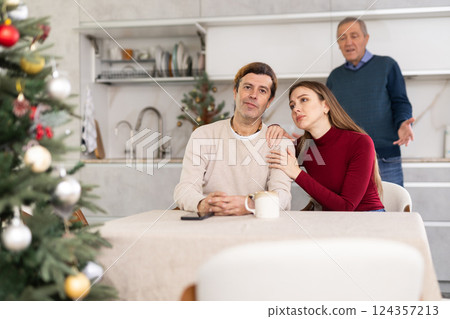 Elderly man quarreling with man and woman couple Elderly man quarreling with man and woman couple 124357213