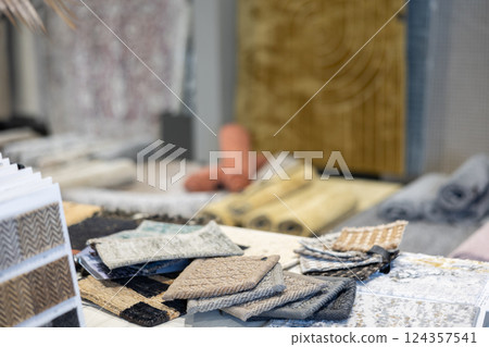 Samples of carpets made of different materials, density, softness and colors. Large selection in hardware store Samples of carpets made of different materials, density, softness and colors. Large selection in hardware store 124357541