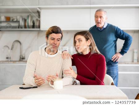 Elderly man quarreling with man and woman couple Elderly man quarreling with man and woman couple 124357739