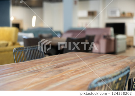 Wooden table displayed in furniture store 124358202