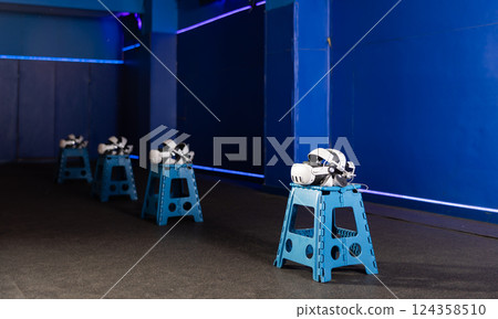 Modern virtual reality glasses and joysticks in an entertainment club Modern virtual reality glasses and joysticks in an entertainment club 124358510