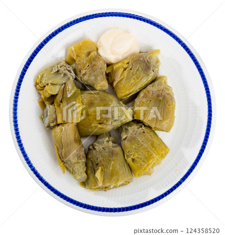 Artichoke cores baked in oven are served with spicy garlic alioli sauce Artichoke cores baked in oven are served with spicy garlic alioli sauce 124358520