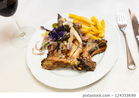 Pork chop with potatoes and vegetables Pork chop with potatoes and vegetables 124358699