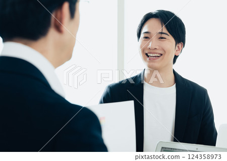 Business people having a meeting in a conference room Business people having a meeting in a conference room 124358973