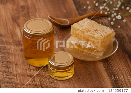 木紋上的蜂蜜罐 com 蜂蜜 124359177