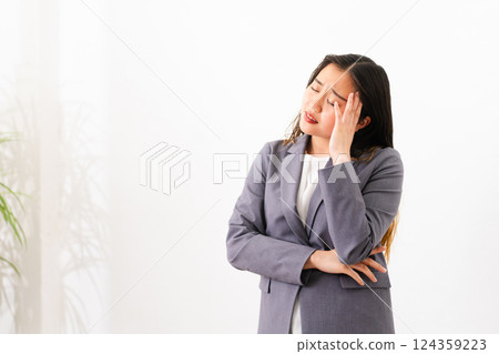 Young woman wearing a business suit Business image Young woman wearing a business suit Business image 124359223