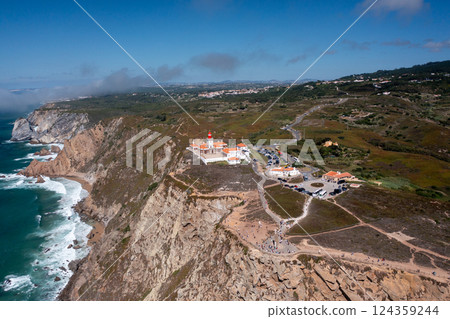 Aerial view of lighthouse with ocean cliffs and Aerial view of lighthouse with ocean cliffs and 124359244