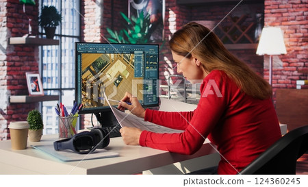 Remote worker in creative office uses CAD software and blueprints plan, design a house interior and provides a user interface for virtual home customization. Detailed architectural layout. Camera B. 124360245