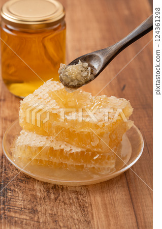Thick com honey on a wooden background Thick com honey on a wooden background 124361298