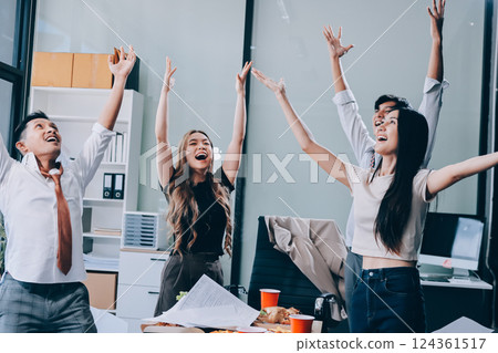 Asian office colleagues and friends enjoy a daytime BBQ with pizza and beer, celebrating Halloween and cheering for their favorite soccer team, creating a lively atmosphere filled with joy. Asian office colleagues and friends enjoy a daytime BBQ with pizza and beer, celebrating Halloween and cheering for their favorite soccer team, creating a lively atmosphere filled with joy. 124361517