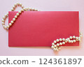 Envelope and pearls 124361897