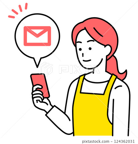 A woman in an apron receiving an email on her smartphone 124362031