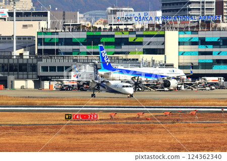 Osaka International Airport ANA Bombardier DHC8-Q400 Propeller Aircraft Takeoff Ready Sky Park 124362340