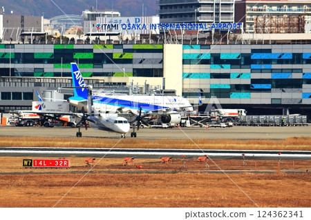 Osaka International Airport ANA Bombardier DHC8-Q400 Propeller Aircraft Takeoff Ready Sky Park 124362341