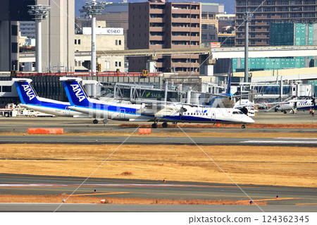 Osaka International Airport ANA Bombardier DHC8-Q400 Propeller Aircraft Takeoff Ready Sky Park 124362345