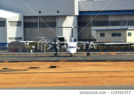 Osaka International Airport ANA Bombardier DHC8-Q400 Propeller Aircraft Takeoff Ready Sky Park 124362357