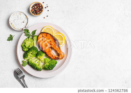 Grilled Salmon fish steak with broccoli. Fitness menu. Grilled Salmon fish steak with broccoli. Fitness menu. 124362786