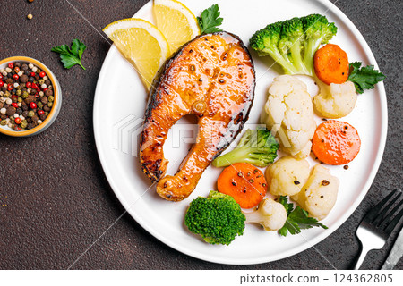 Grilled salmon fish steak with steamed vegetables 124362805
