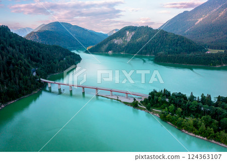 Drone image with the Sylvenstein Lake surrounded by mountains, in Upper Bavaria, Germany 124363107