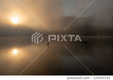 Sunrise on a foggy morning over Lake Sylvenstein in Bavaria, Germany Sunrise on a foggy morning over Lake Sylvenstein in Bavaria, Germany 124363145