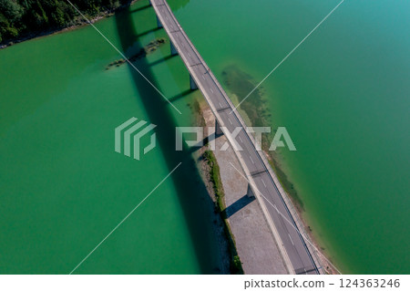 Aerial view of the Sylvenstein Lake Bridge in the bright light of summer Aerial view of the Sylvenstein Lake Bridge in the bright light of summer 124363246