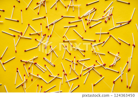 Wooden stick matches over yellow background. Wooden stick matches over yellow background. 124363450