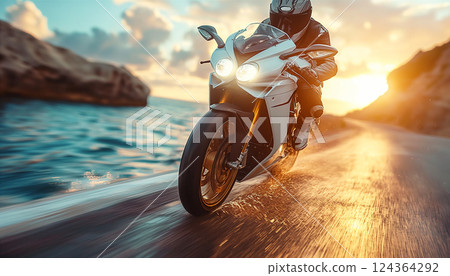 Motorcyclist speeds along coastal road at sunset, creating splashes of water. Generative AI 124364292