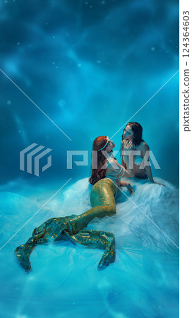 Graceful mermaid lounging on delicate flowing fabric, draped in pearls, lost in a dreamy oceanic world. 124364603