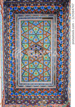 beautiful wooden painted carved ceiling in Museum of Art of Uzbekistan with Uzbek ornaments and colorful oriental patterns in Tashkent 124364747