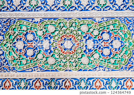 colorful carved wooden painted background with traditional Uzbek ornaments and oriental patterns in Tashkent in Uzbekistan 124364749