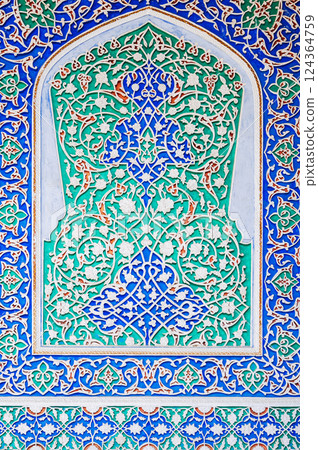 beautiful carved wooden painted background in the Museum of Art of Uzbekistan with traditional Uzbek ornaments and colorful oriental patterns in Tashkent 124364759