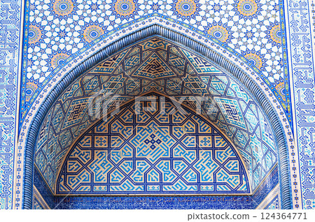 arch of a Muslim mosque decorated with ceramic tiles with a traditional Uzbek oriental pattern in Tashkent in Uzbekistan arch of a Muslim mosque decorated with ceramic tiles with a traditional Uzbek oriental pattern in Tashkent in Uzbekistan 124364771