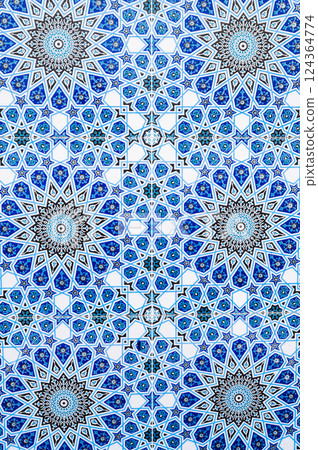 ceramic tiles with traditional Uzbek oriental pattern in Uzbekistan. Blue decorative background with Islamic ornament 124364774
