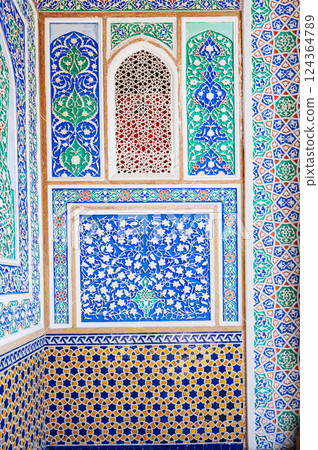 beautiful carved wooden painted wall in Museum of Art of Uzbekistan with traditional Uzbek ornaments and oriental patterns in Tashkent 124364789