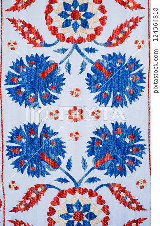 A traditional Uzbek geometric pattern on ancient carpet in Uzbekistan. Oriental white background with beautiful ornaments A traditional Uzbek geometric pattern on ancient carpet in Uzbekistan. Oriental white background with beautiful ornaments 124364818