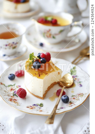 Breakfast. brunch. Slice of cheesecake are served with honey, fresh berries on white tablecloth. 124364924