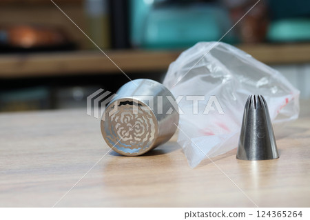 Set of pastry tips made from stainless steel. For making marshmallows. Plastic pastry bag included. Eye-level Shot Set of pastry tips made from stainless steel. For making marshmallows. Plastic pastry bag included. Eye-level Shot 124365264