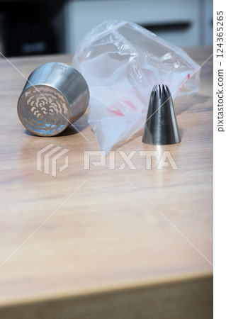Set of pastry tips made from stainless steel. For making marshmallows. Plastic pastry bag included. Eye-level Shot 124365265